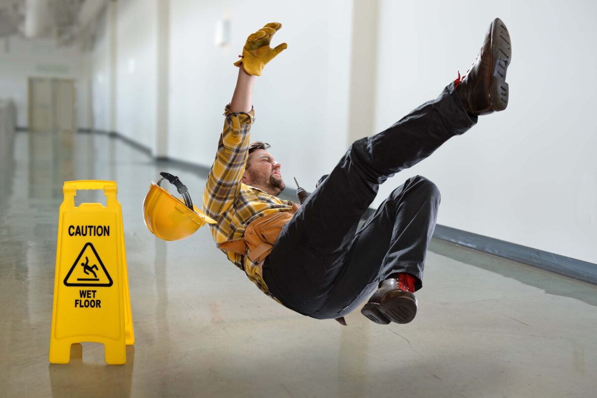 Worker falling on wet ground inside building