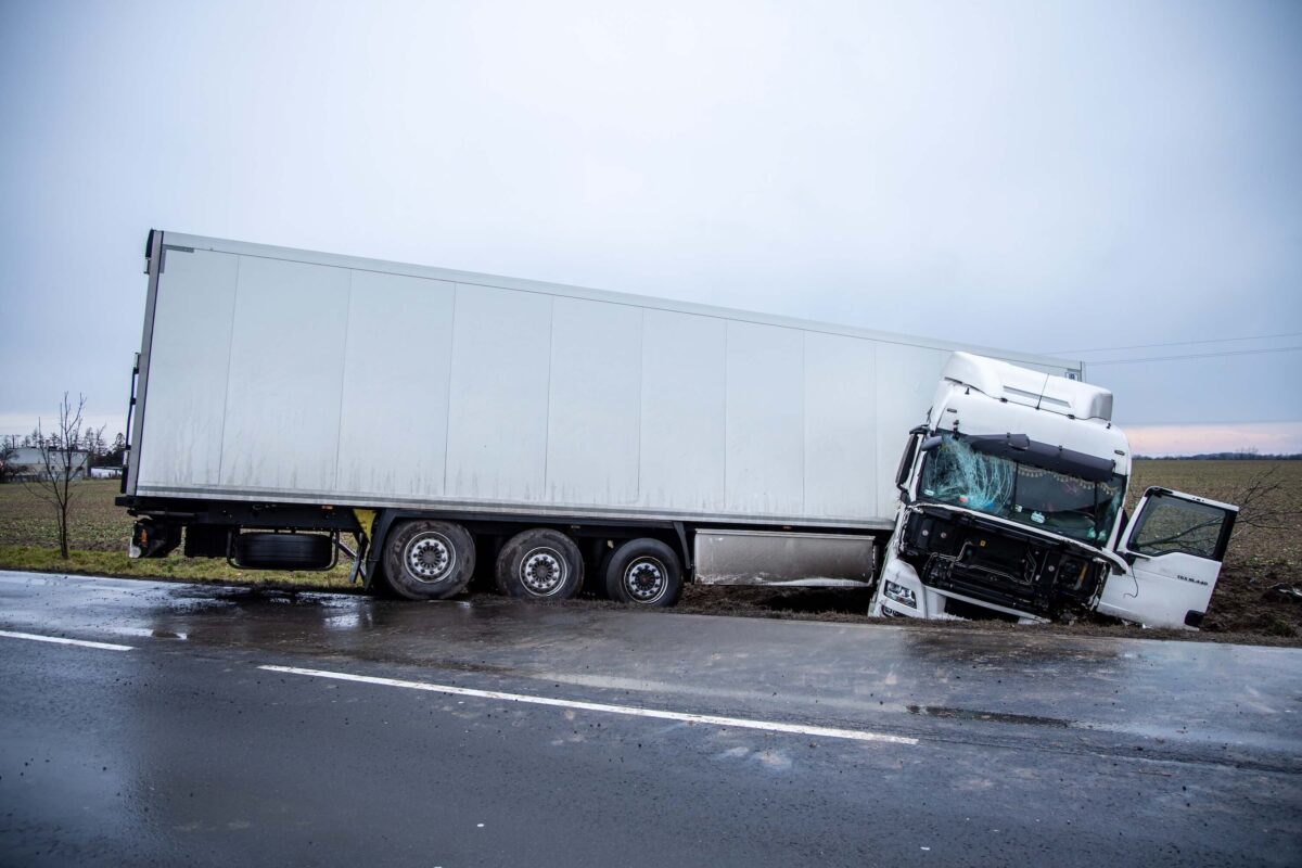 Damaged white truck with a semi-trailer Damaged white truck with a semi-trailer